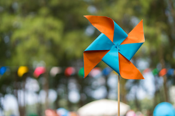 Children toy, Blue and orange color of Paper Turbine in the wind.