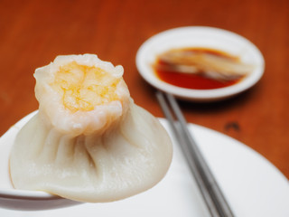 Steamed seafood shao mai in spoon