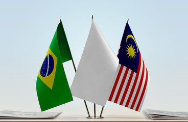 Flags of Brazil and Malaysia with a white flag in the middle