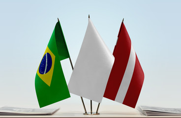 Flags of Brazil and Latvia with a white flag in the middle