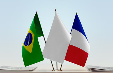 Flags of Brazil and France with a white flag in the middle
