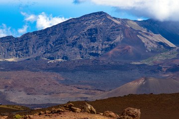 Crater peak, caldera, and clouds at the 10,000' summit of the volcano at Haleakala National Park on the southern half of the island of Maui in Hawaii