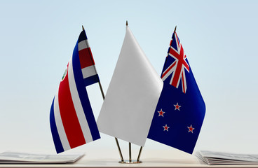 Flags of Costa Rica and New Zealand with a white flag in the middle