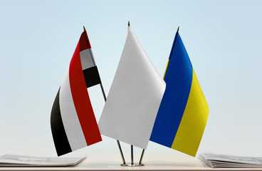 Flags of Yemen and Ukraine with a white flag in the middle