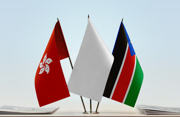Flags of Hong Kong and South Sudan with a white flag in the middle