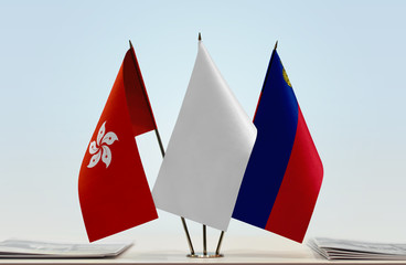 Fototapeta na wymiar Flags of Hong Kong and Liechtenstein with a white flag in the middle
