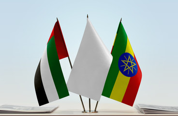 Flags of UAE and Ethiopia with a white flag in the middle