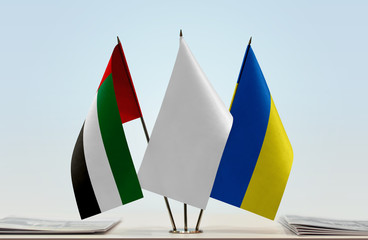 Flags of UAE and Ukraine with a white flag in the middle