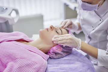 girl in cosmetic procedures of the face
