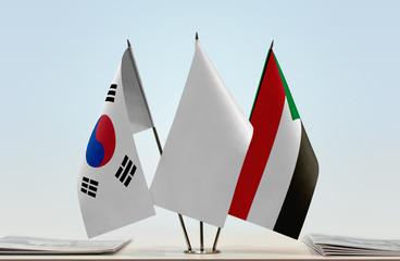 Flags of South Korea and Sudan with a white flag in the middle