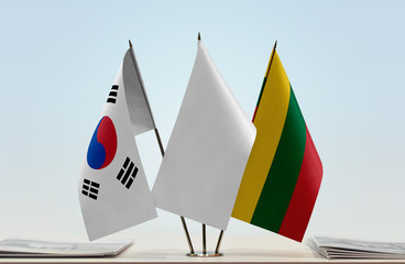 Flags of South Korea and Lithuania with a white flag in the middle