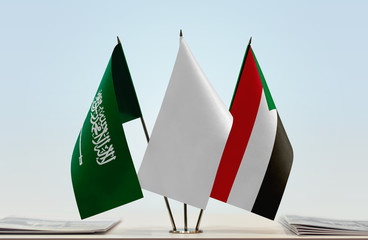 Flags of Saudi Arabia and Sudan with a white flag in the middle