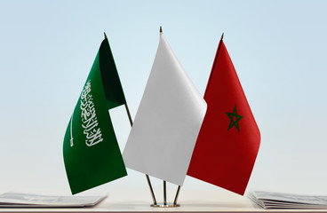Flags of Saudi Arabia and Morocco with a white flag in the middle
