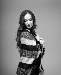 Black and white Portrait of a beautiful girl with long hair on a dark background in the studio