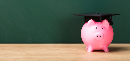 Close-up Of A Piggy Bank With Graduation Cap