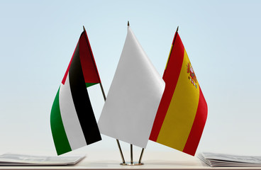 Flags of Palestine and Spain with a white flag in the middle