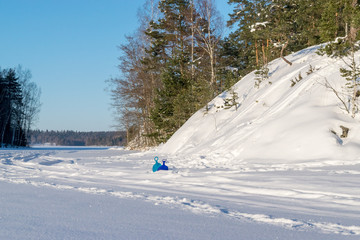 Fototapeta na wymiar Frozen and snowy lake, winter landscape