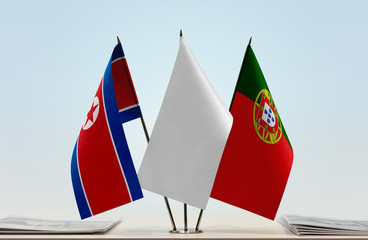 Flags of North Korea and Portugal with a white flag in the middle