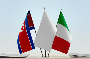 Flags of North Korea and Italy with a white flag in the middle