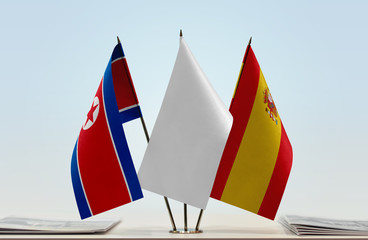 Flags of North Korea and Spain with a white flag in the middle