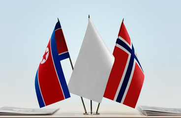 Flags of North Korea and Norway with a white flag in the middle