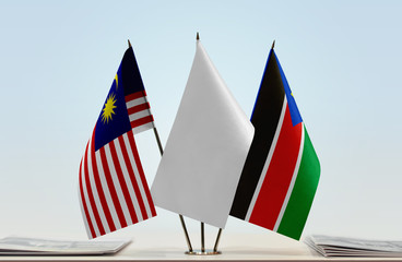 Flags of Malaysia and South Sudan with a white flag in the middle