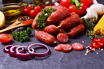 Sausage with salami with spices and vegetables