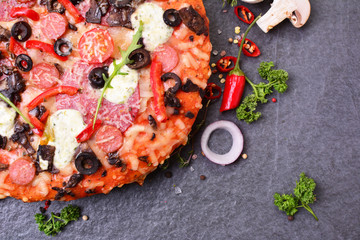 Excellent Italian pizza with cheese and tomatoes, and olives