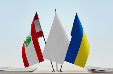 Flags of Lebanon and Ukraine with a white flag in the middle