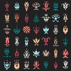 Obraz na płótnie Canvas Vector set of decorative color flowers in ethnic style on a black background.