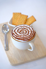Hot coffee decorated with caramel macchiato served , Macchiato coffee, Latte art, Hot beverage with caramel syrup,