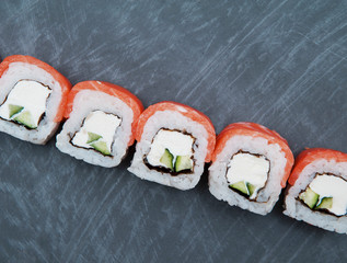Sushi on black stone background