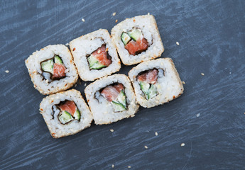 Sushi on black stone background