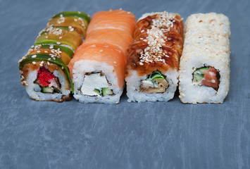 Sushi on black stone background