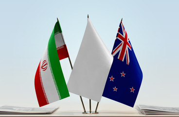Flags of Iran and New Zealand with a white flag in the middle