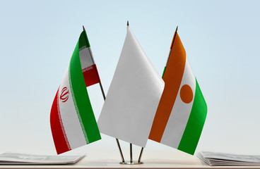 Flags of Iran and Niger with a white flag in the middle