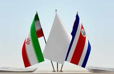 Flags of Iran and Costa Rica with a white flag in the middle