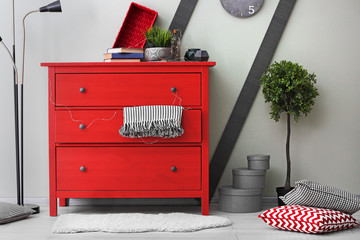 Cozy wardrobe room interior with red chest of drawers - obrazy, fototapety, plakaty