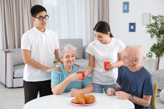 Senior people with young caregivers at home