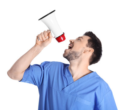 Male doctor with megaphone on white background