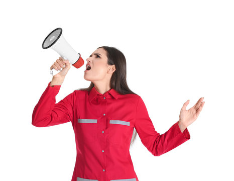 Young woman in red uniform with megaphone on white background