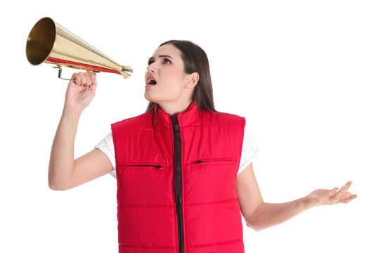 Young woman in red vest with megaphone on white background