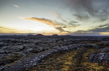 Icelandic landscape with lava and rocks in sundown