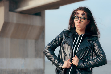 Fashion Girl with Steampunk Flip Up Glasses and Leather Jacket