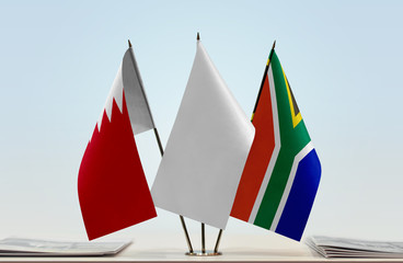 Flags of Bahrain and Republic of South Africa with a white flag in the middle