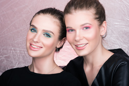Portrait of two young pretty women. Bright professional makeup