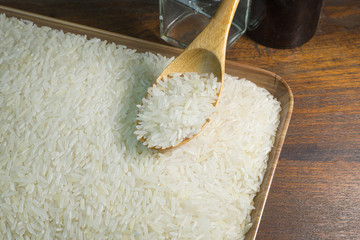 rice grain  on wood table image for background.