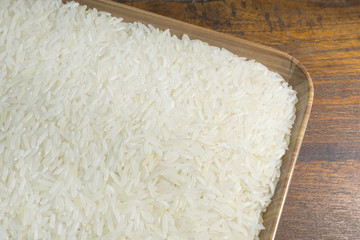 rice grain  on wood table image for background.