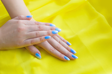 Fototapeta premium Bright spring manicure. Spring ideas for women, beauty and care for hands and nails 