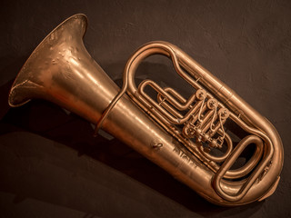 A musical musical tube hangs on the wall